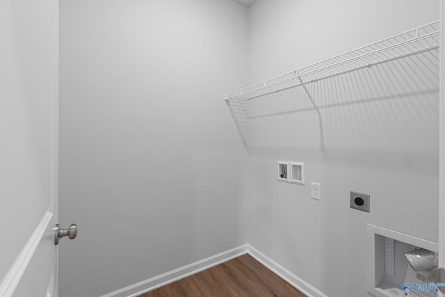 laundry area featuring laundry area, electric dryer hookup, washer hookup, baseboards, and dark wood-style floors