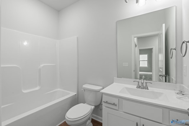 full bath with toilet,  shower combination, and vanity