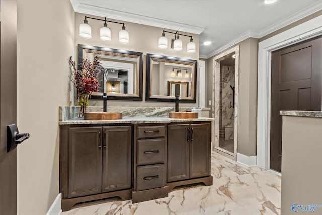 bathroom with vanity, ornamental molding, and a shower