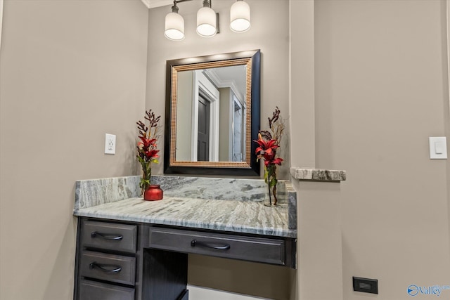 bathroom with vanity and crown molding