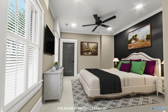 bedroom with ceiling fan, light colored carpet, and ornamental molding