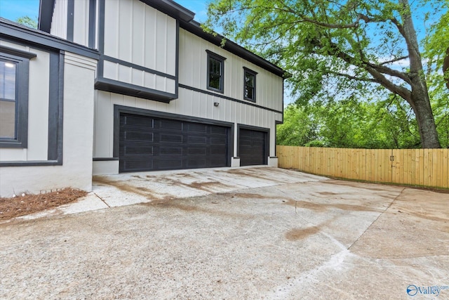 view of side of property featuring a garage