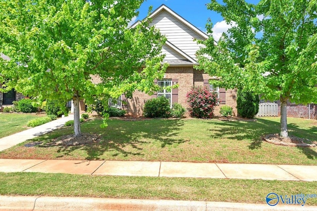 5 Leyland Dr, Huntsville, AL 35824 - obstructed view of property featuring brick siding
