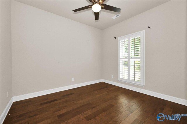 5 Leyland Dr, Huntsville, AL 35824 - spare room featuring dark wood-type flooring, ceiling fan, and baseboards