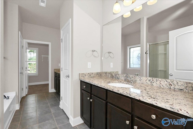 5 Leyland Dr, Huntsville, AL 35824 - full bath featuring a shower stall, vanity, baseboards, tile patterned flooring, and a bath