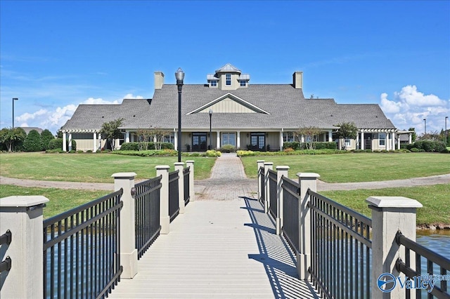 5 Leyland Dr, Huntsville, AL 35824 - rear view of house with a lawn and a shingled roof