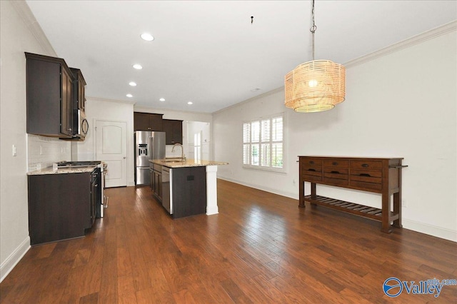 5 Leyland Dr, Huntsville, AL 35824 - kitchen with appliances with stainless steel finishes, ornamental molding, dark brown cabinets, baseboards, and a sink