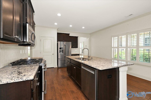 5 Leyland Dr, Huntsville, AL 35824 - kitchen featuring a sink, stainless steel appliances, ornamental molding, tasteful backsplash, and dark brown cabinetry