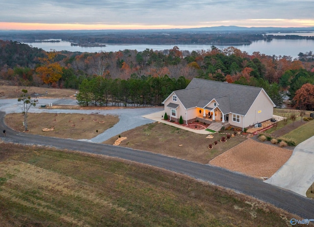 aerial view at dusk with a water view