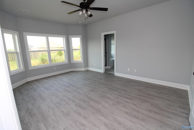 unfurnished room with ceiling fan and hardwood / wood-style floors