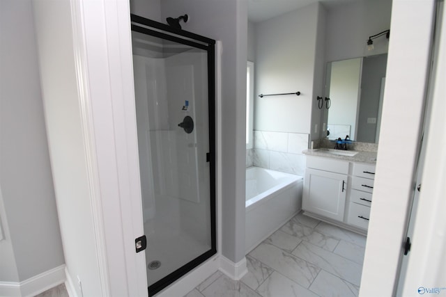 bathroom with vanity and separate shower and tub