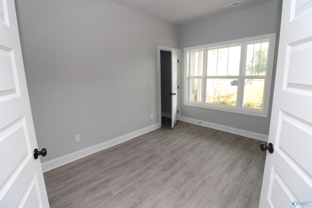 unfurnished bedroom featuring hardwood / wood-style floors