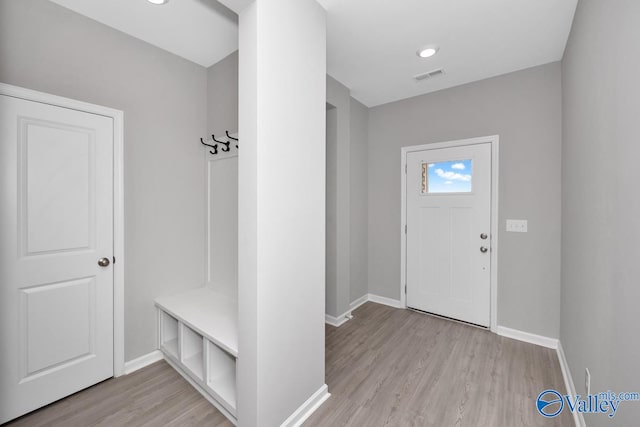 mudroom with light hardwood / wood-style flooring