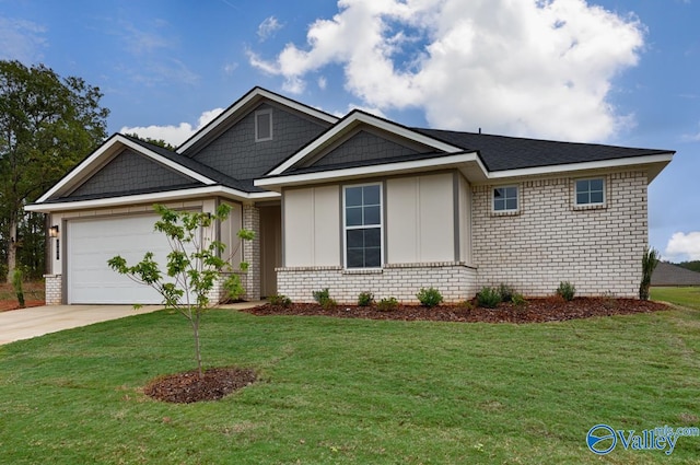 view of front of home with a garage and a front lawn