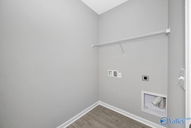 washroom with hookup for an electric dryer, wood-type flooring, and washer hookup