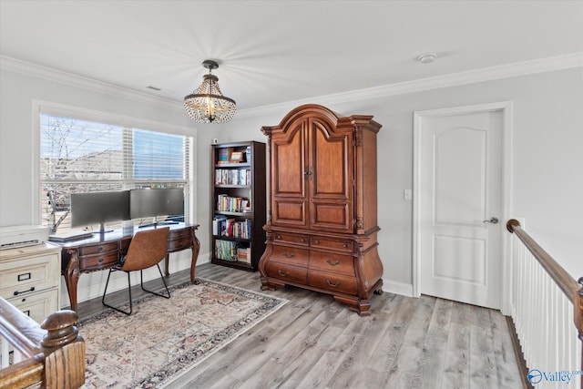 home office with a chandelier, ornamental molding, light wood-style flooring, and baseboards