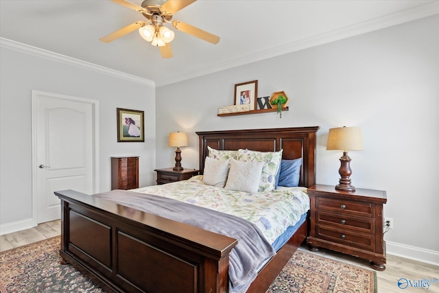 bedroom featuring ornamental molding, light wood finished floors, a ceiling fan, and baseboards