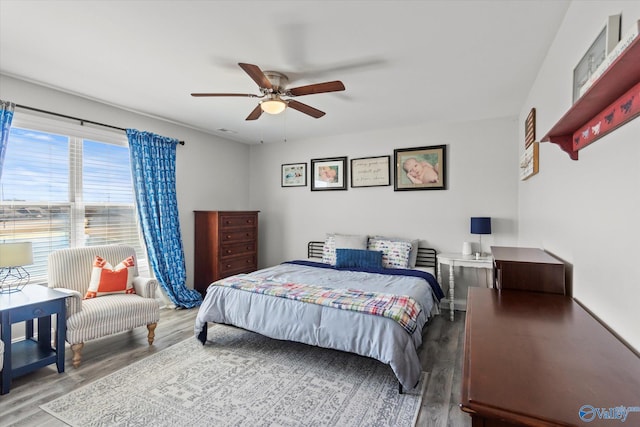 bedroom with ceiling fan and wood finished floors