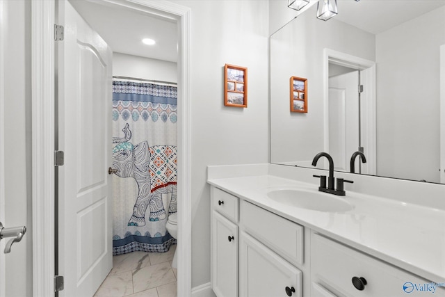 bathroom with marble finish floor, a shower with shower curtain, vanity, and toilet