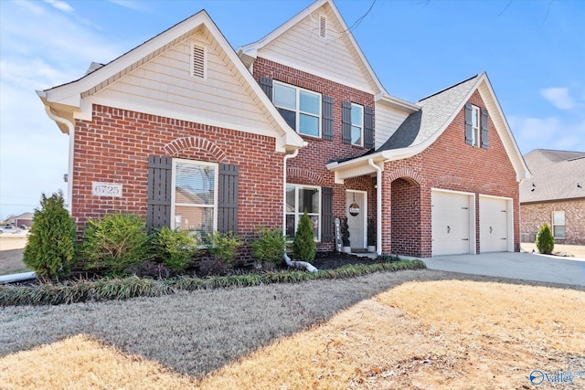 traditional-style home with concrete driveway and brick siding