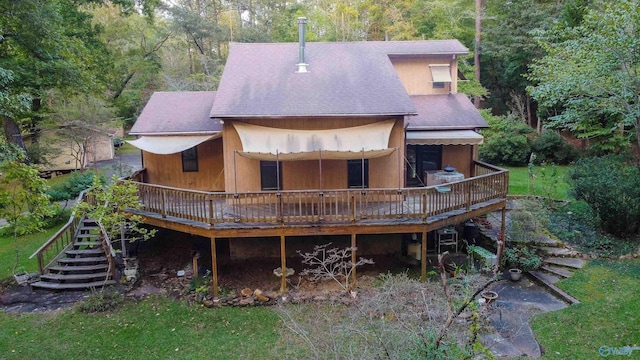 back of house with a wooden deck