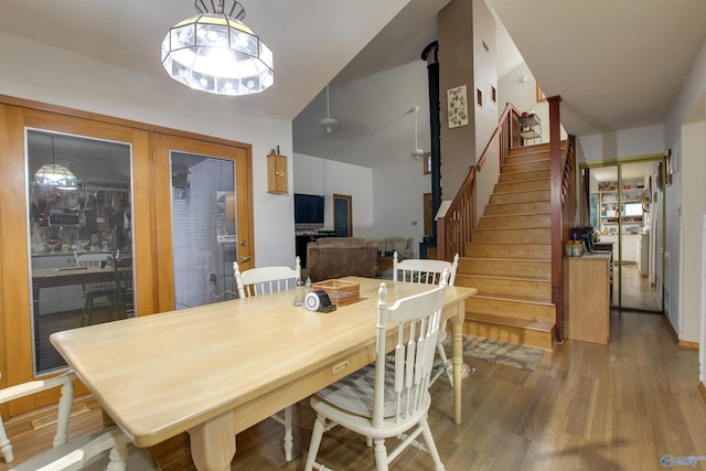 dining space with wood-type flooring