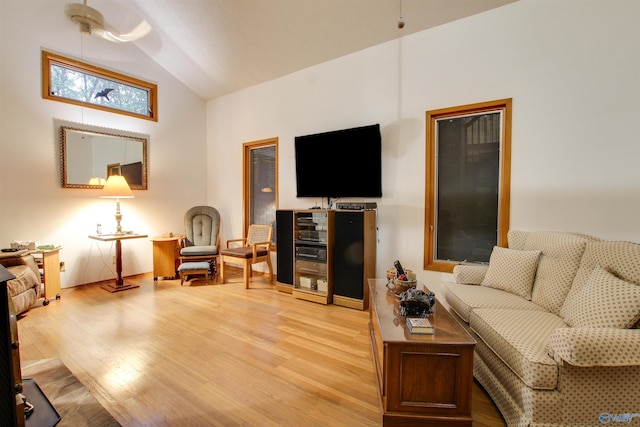 living room featuring light hardwood / wood-style floors and lofted ceiling