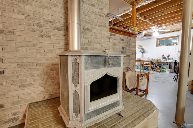 details featuring concrete flooring and a wood stove