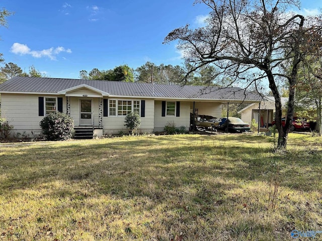 ranch-style home featuring a front lawn and a carport