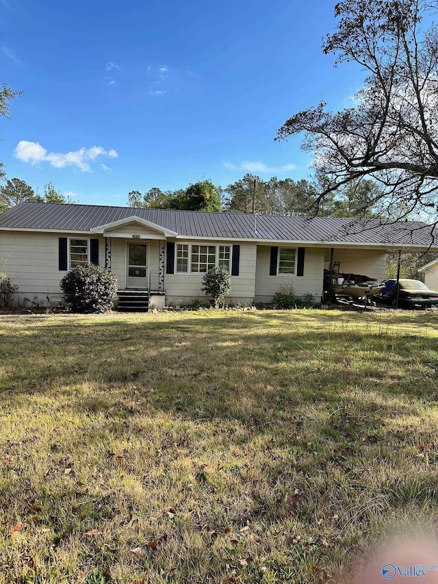 ranch-style home with a front lawn and a carport