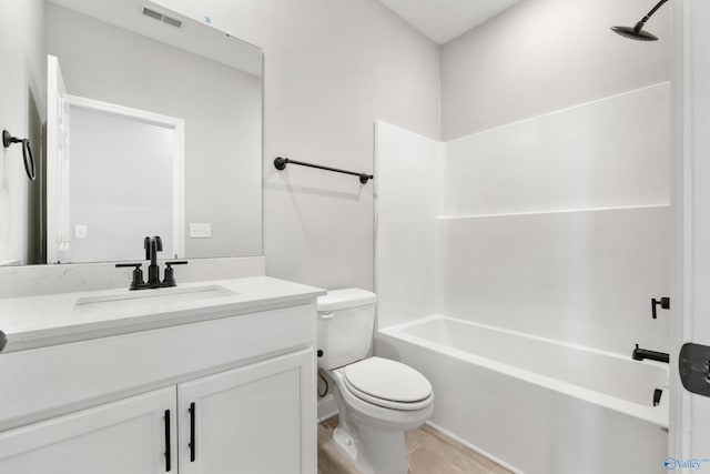 bathroom with visible vents, bathing tub / shower combination, toilet, and vanity