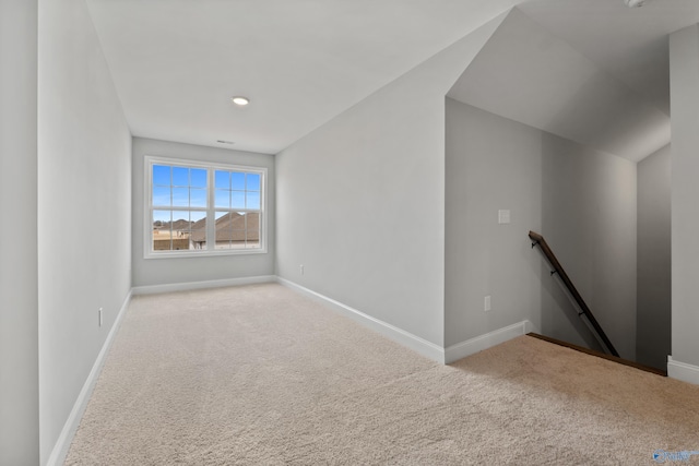 spare room with carpet and baseboards