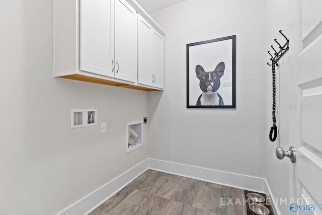 laundry room featuring hookup for a washing machine, cabinet space, electric dryer hookup, and baseboards