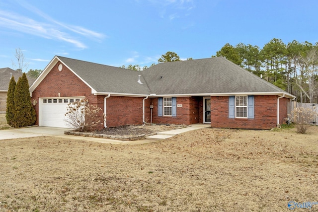 ranch-style home with a garage and a front yard