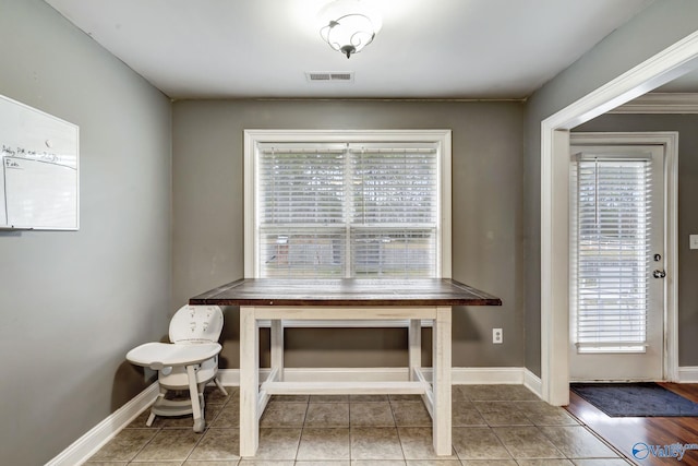 unfurnished dining area with tile patterned floors and a healthy amount of sunlight