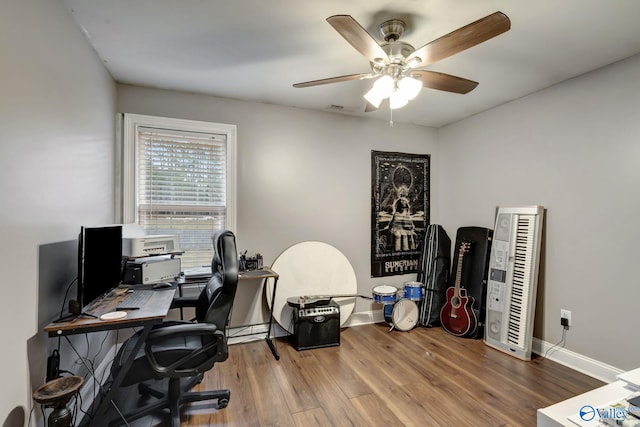 office with hardwood / wood-style floors and ceiling fan