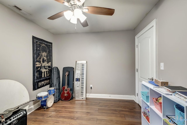 misc room featuring ceiling fan and wood-type flooring