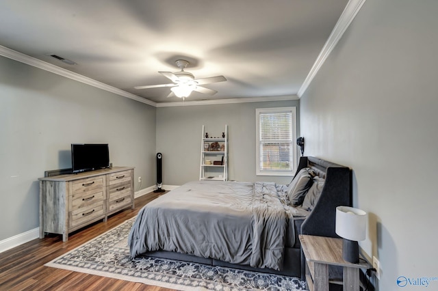 bedroom with dark hardwood / wood-style flooring, ornamental molding, and ceiling fan