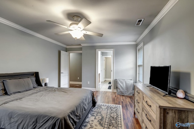 bedroom with crown molding, ceiling fan, and dark hardwood / wood-style floors