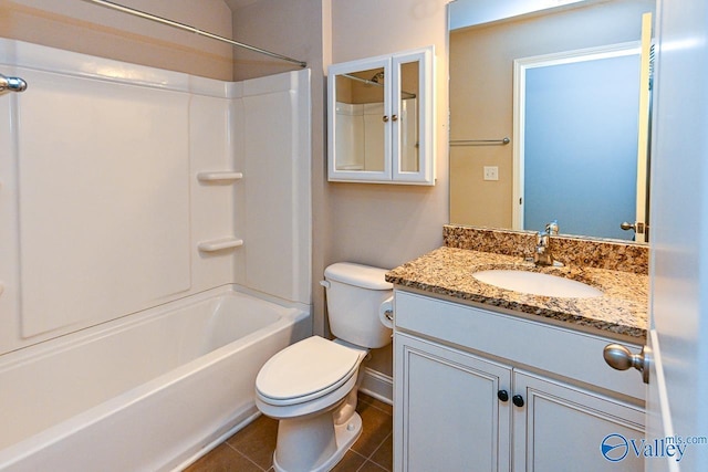 9 Leyland Dr SW, Huntsville, AL 35824 - full bath featuring toilet, vanity, baseboards, shower / bathing tub combination, and tile patterned floors
