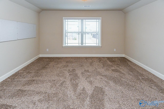 9 Leyland Dr SW, Huntsville, AL 35824 - carpeted empty room with lofted ceiling, visible vents, and baseboards