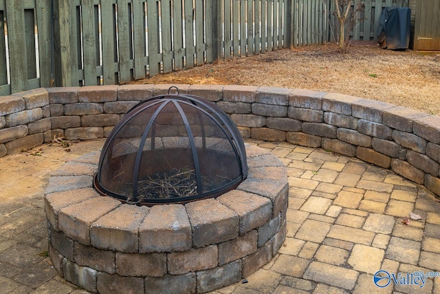 9 Leyland Dr SW, Huntsville, AL 35824 - exterior details featuring an outdoor fire pit and fence