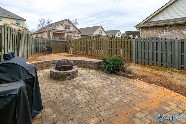 9 Leyland Dr SW, Huntsville, AL 35824 - view of patio / terrace with an outdoor fire pit, a fenced backyard, grilling area, a residential view, and a pergola
