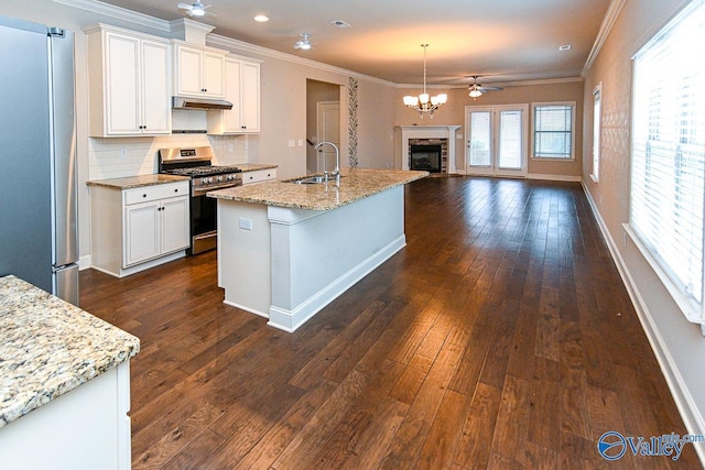 9 Leyland Dr SW, Huntsville, AL 35824 - kitchen with open floor plan, stainless steel appliances, a sink, and white cabinets