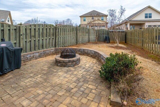 9 Leyland Dr SW, Huntsville, AL 35824 - view of patio / terrace with an outdoor fire pit, grilling area, and a fenced backyard