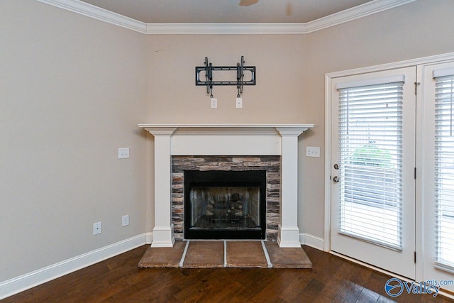 9 Leyland Dr SW, Huntsville, AL 35824 - room details featuring ornamental molding, a fireplace with raised hearth, baseboards, and wood finished floors