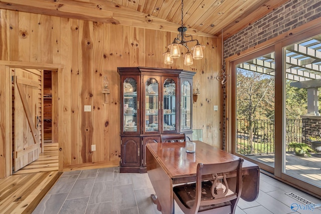 dining area with an inviting chandelier, brick wall, wooden ceiling, and lofted ceiling