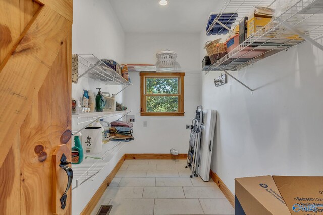 laundry area featuring tile patterned floors