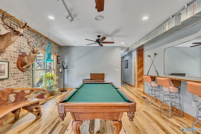 playroom featuring brick wall, billiards, light hardwood / wood-style floors, and ceiling fan