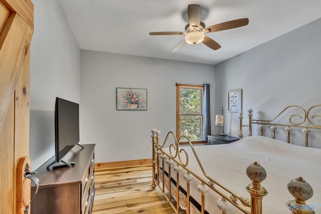 bedroom featuring light wood-type flooring and ceiling fan